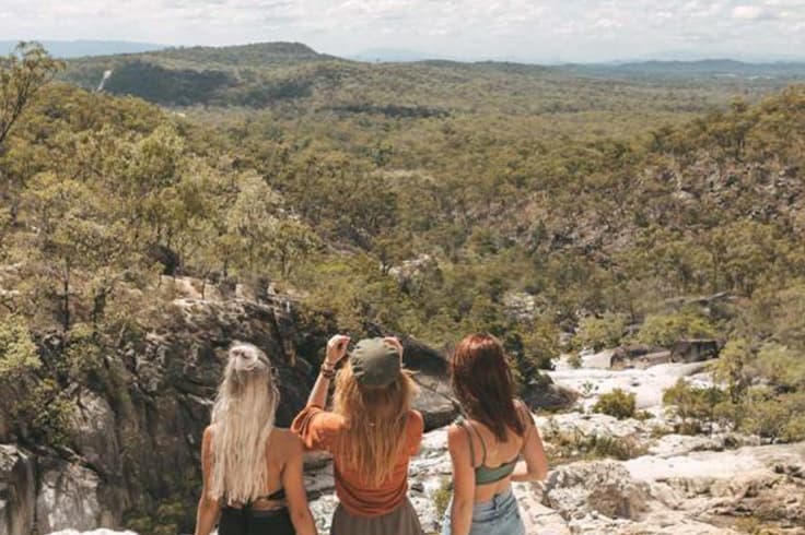 11 highlights from a road trip in tropical north queensland 1 girls taking a photo at emerald creek falls in queensland