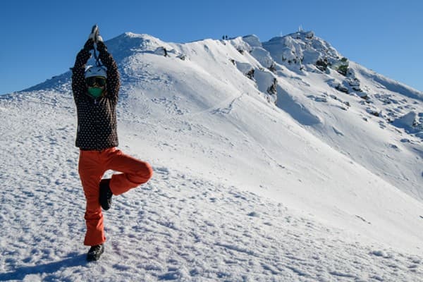 Ski slopes, Queenstown, New Zealand Person posing on ski field