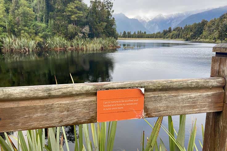 Motivational signpost by Lake Matheson, South Island, New Zealand.
