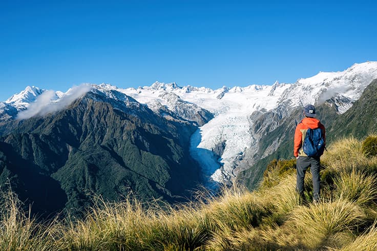Man hiking through mountains Man hiking through mountains